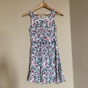 Divided criss cross cutout floral dress